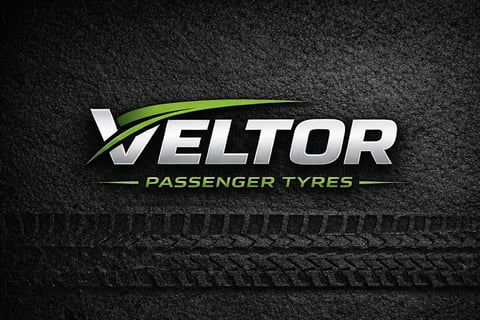Veltor Passenger Tires logo with white and green text on textured dark background with tire tread detail